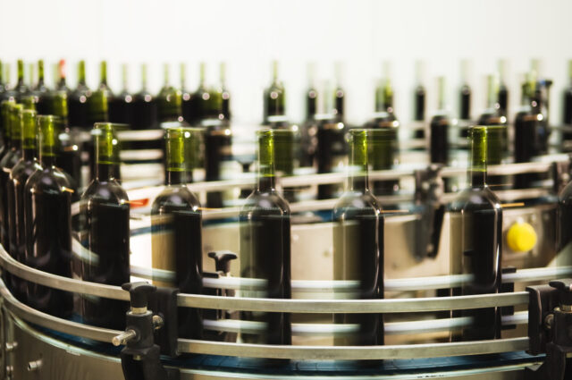 Photo of a turntable of a bottle filling line at a modern winery